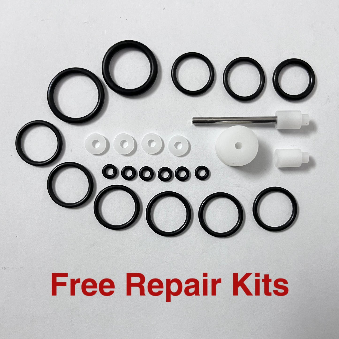 Collection of black and white repair parts on a white background with 'Free Repair Kits' text.