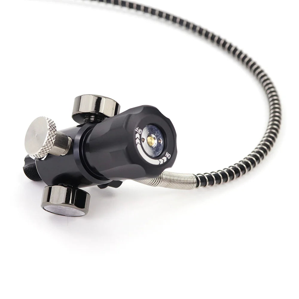 Black and silver underwater camera light with coiled cable on a white background
