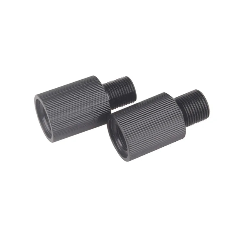 Two black metal spacers on a white background